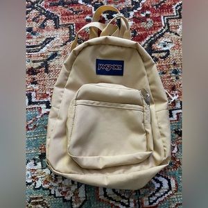 Jansport mini backpack in Curry